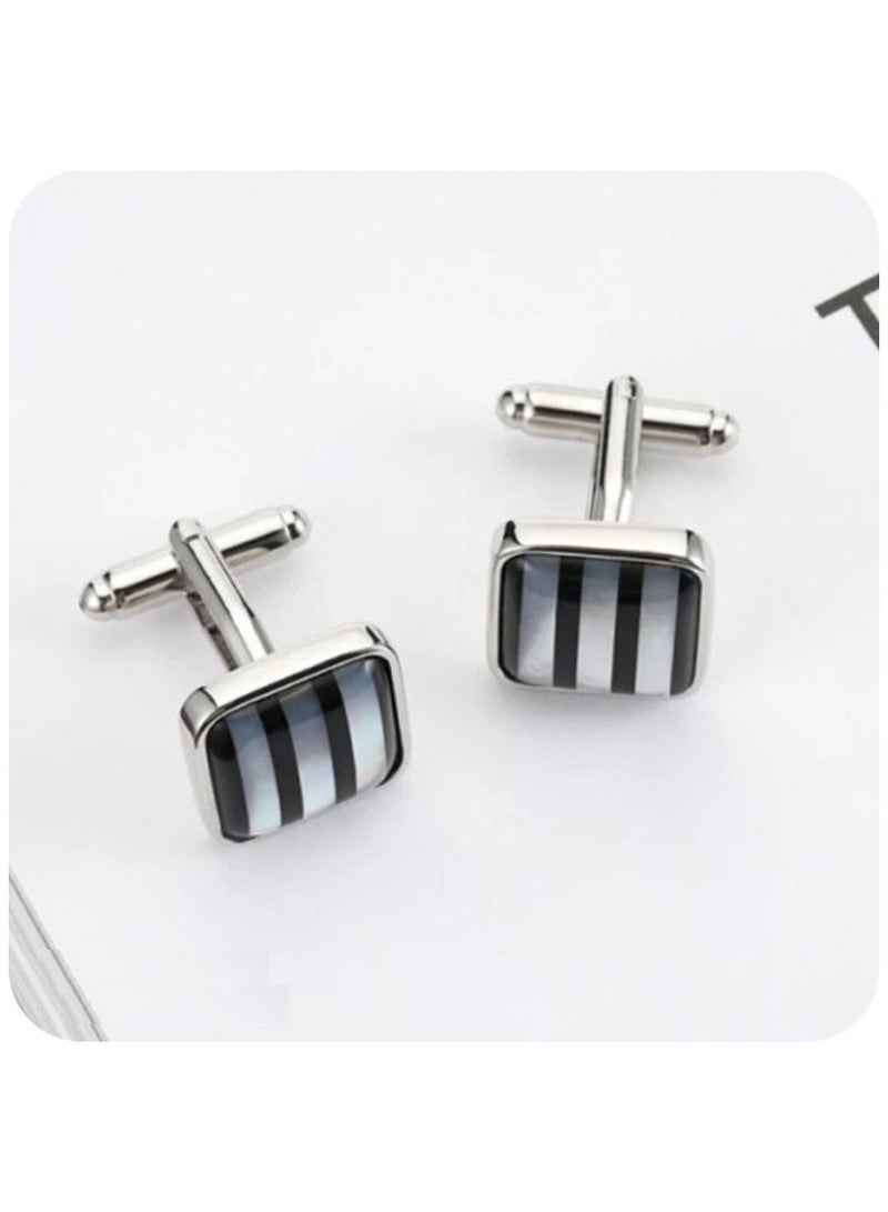 An elegant pearl shell cufflinks set