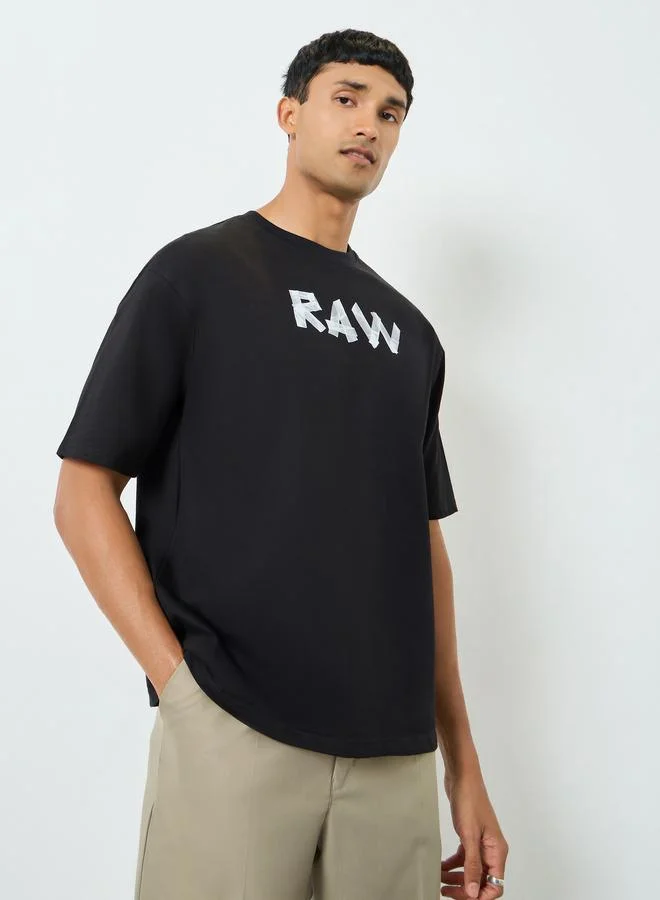 Styli Men Black Graphic Print Oversized Terry T-Shirt