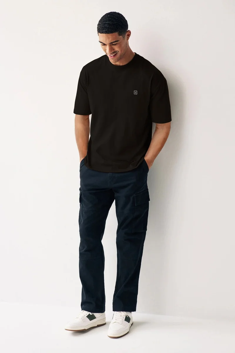 Urbano Fashion  Urbano Fashion Men's Jet Black Solid Round Neck Oversized Half Sleeve Cotton T-Shirt  | Best Price UAE