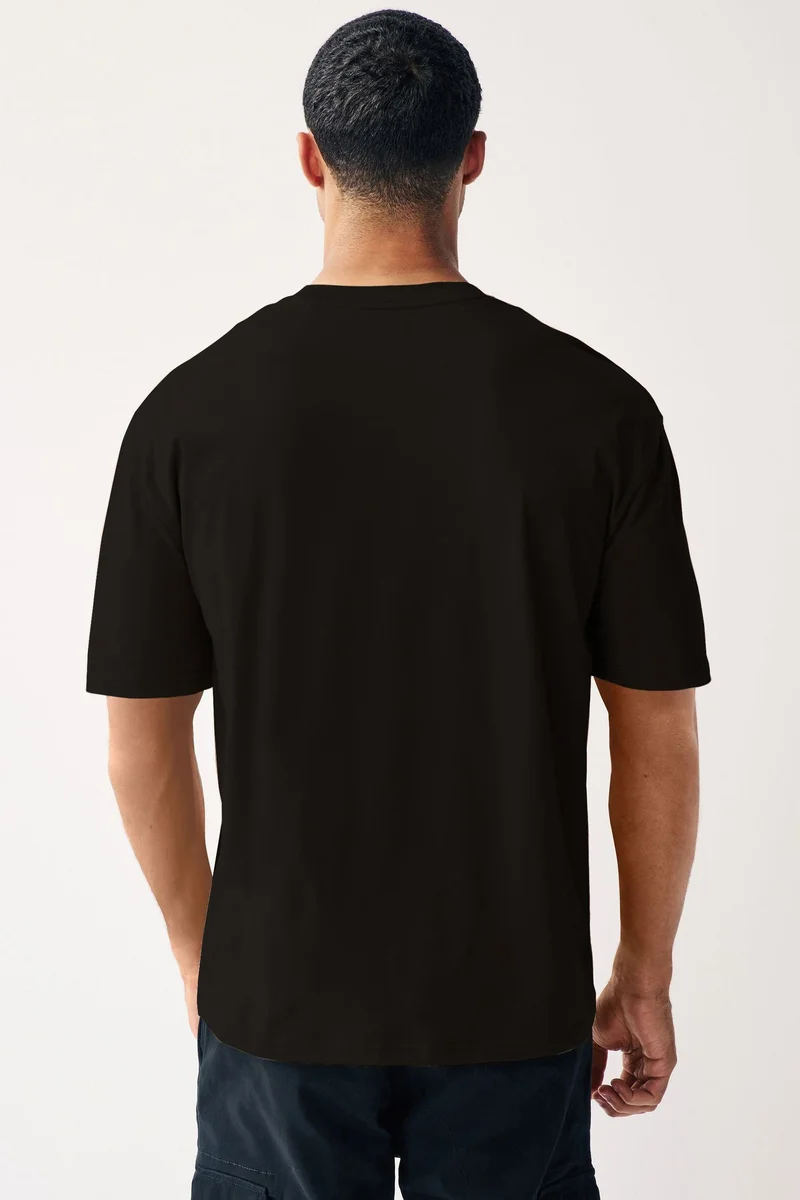 Urbano Fashion  Urbano Fashion Men's Jet Black Solid Round Neck Oversized Half Sleeve Cotton T-Shirt  | Best Price UAE