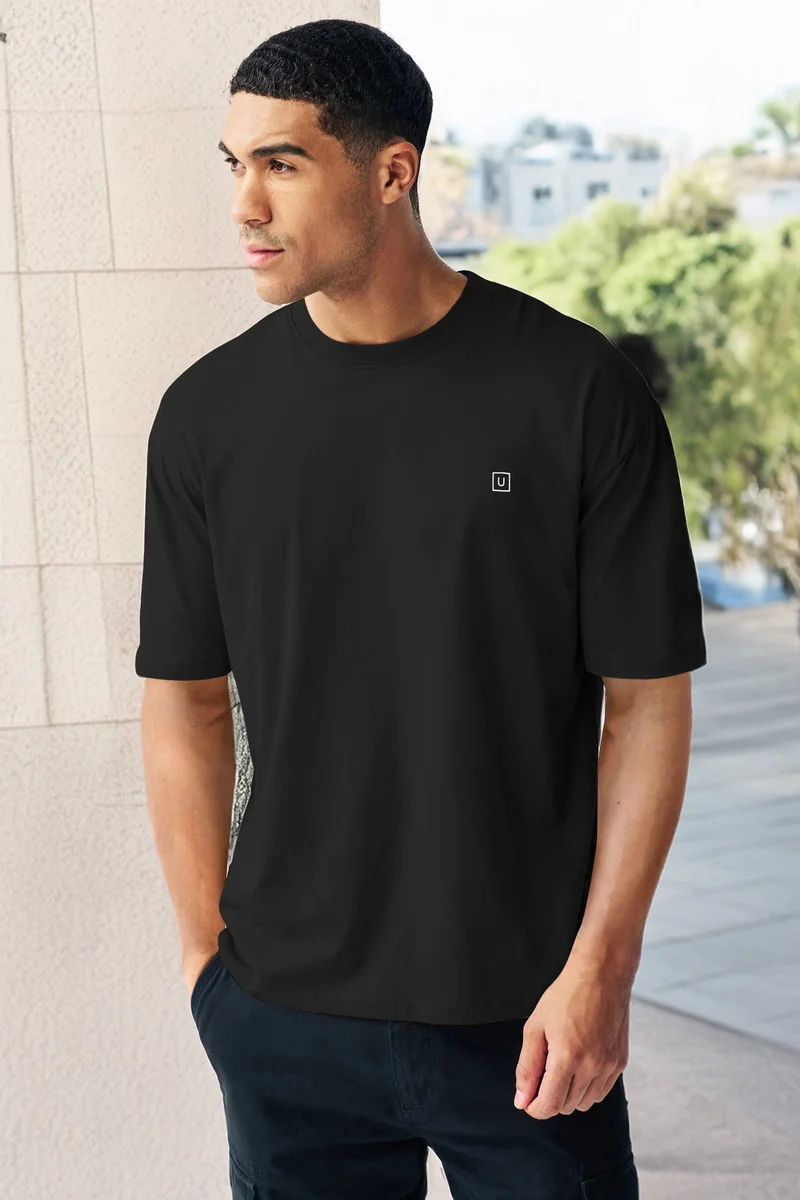 Urbano Fashion  Urbano Fashion Men's Jet Black Solid Round Neck Oversized Half Sleeve Cotton T-Shirt  | Best Price UAE