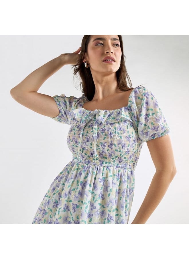 All-Over Floral Print A-line Dress with Ruffles and Shirred Detail - pzsku/ZD678D8797323E17C4413Z/45/_/1728433115/4bc4c237-eab8-46a8-b2c3-19e7f874f10a