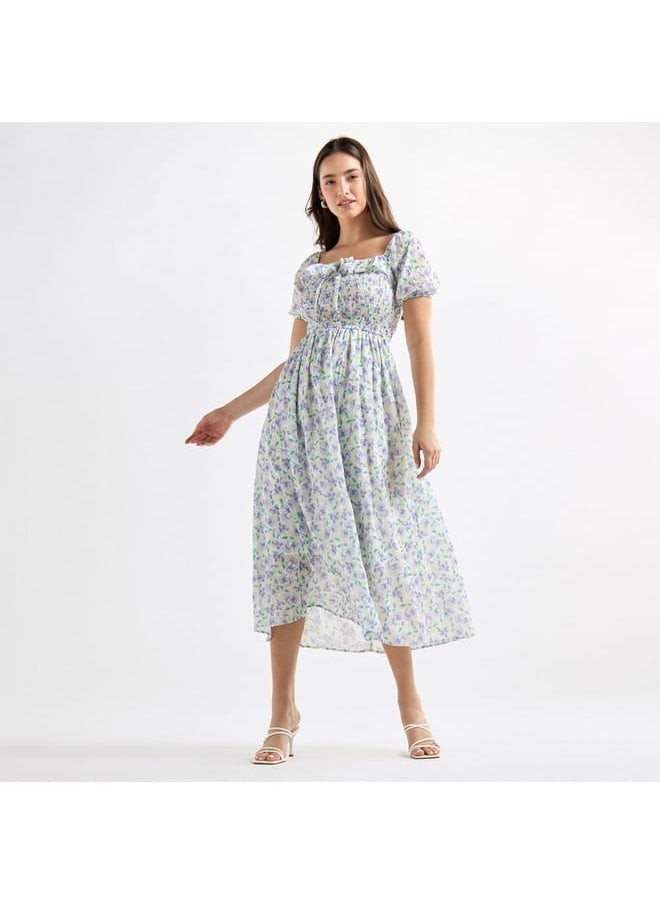 All-Over Floral Print A-line Dress with Ruffles and Shirred Detail - pzsku/ZD678D8797323E17C4413Z/45/_/1728433124/39489268-ef1d-46af-afb1-2139de59ddab