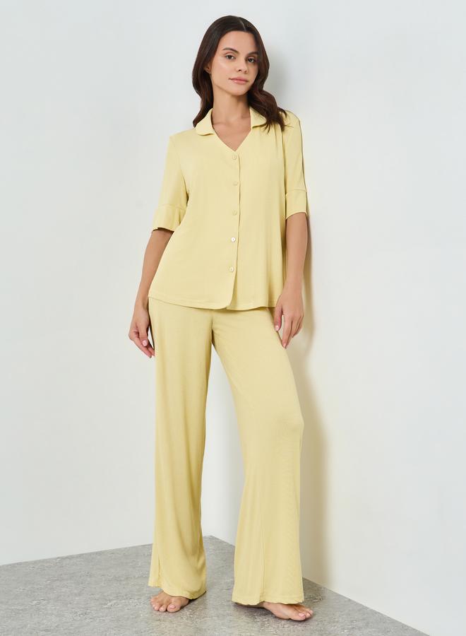 A pajamas set of pants and a knitted blouse with s...