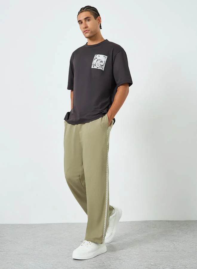 Styli Black Oversized Zig Zag Side Tape Joggers