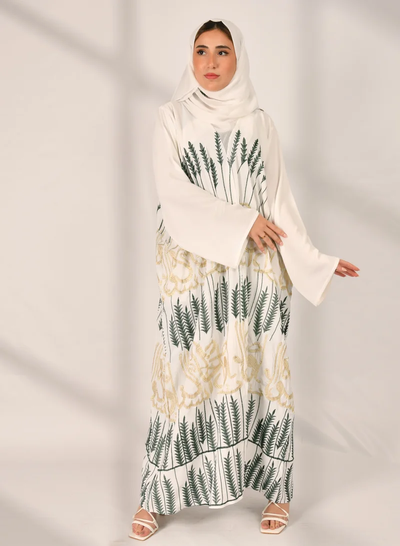 HAWRAA ABAYA White wrap abaya with multiple tree patterns and golden Arabic letter embroidery