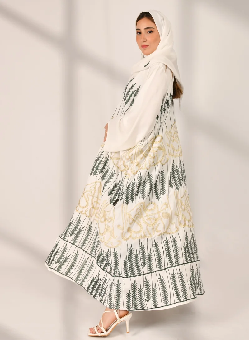HAWRAA ABAYA White wrap abaya with multiple tree patterns and golden Arabic letter embroidery