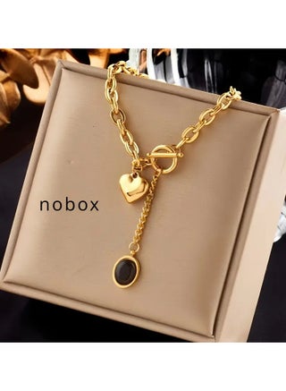 A Golden Stainless Steel Accessory with an 18K Gold-Plated Chunky Chain, Oval Tassel Pendant, Heart OT Buckle, And Titanium Steel Metal Necklace, Perfect for Creative, Stylish, And Trendy Looks. It'S Versatile for Everyday Wear, Street Gatherings, And Festive Parties, Making It an Ideal Gift for Women. - pzsku/ZD6DCA409B87BDA87E07CZ/45/_/1739779288/d522dad2-bb56-4578-9751-c9e075207139