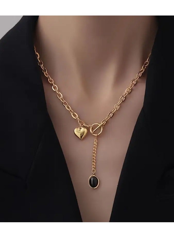 A Golden Stainless Steel Accessory with an 18K Gold-Plated Chunky Chain, Oval Tassel Pendant, Heart OT Buckle, And Titanium Steel Metal Necklace, Perfect for Creative, Stylish, And Trendy Looks. It'S Versatile for Everyday Wear, Street Gatherings, And Festive Parties, Making It an Ideal Gift for Women.