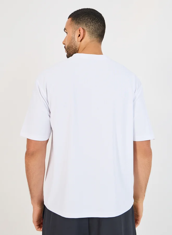 Styli Styli Micro Pique Knit Oversized T-Shirt with Reflective Logo