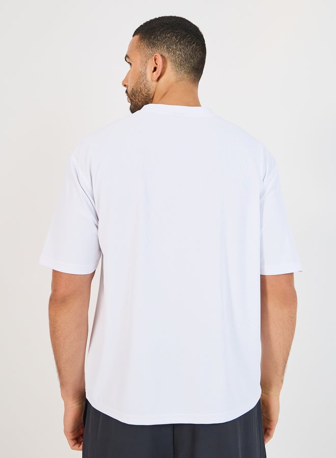 Styli Styli Micro Pique Knit Oversized T-Shirt with Reflective Logo  - Image 4