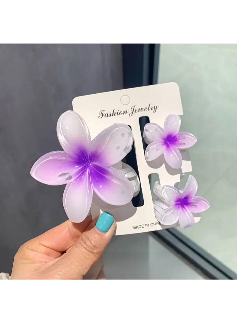Hawaiian Flower Hair Clip Set – 3 Pieces (1 Large & 2 Small) Acrylic Design with Soft Purple Touch - Image 2