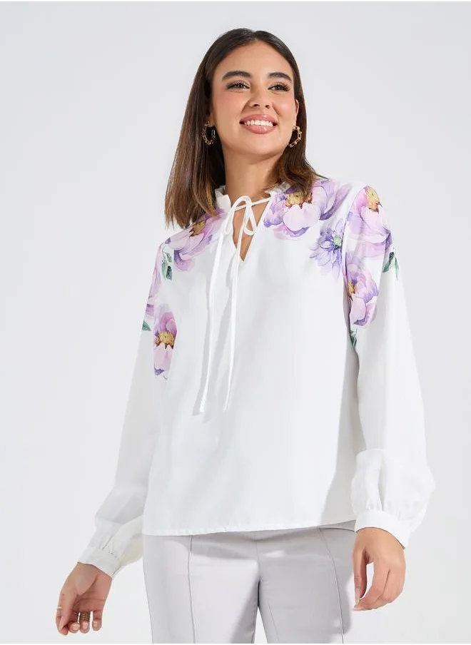 Styli Floral Placement Print Tie-Up Neck Blouse