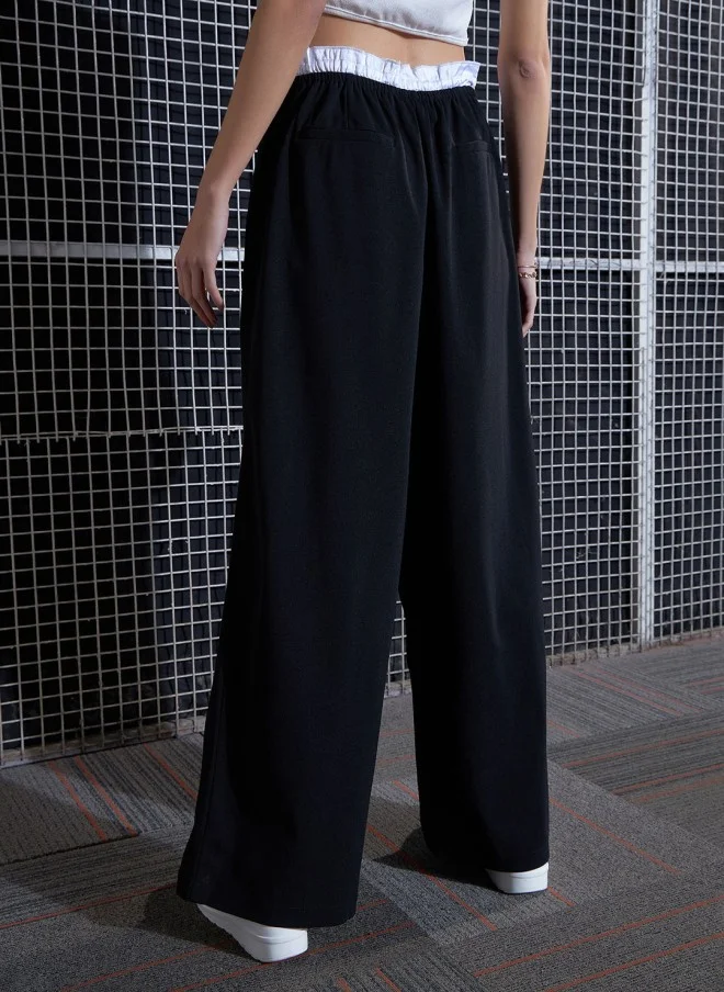 SASSAFRAS Black Loose Fit High-Rise Parallel Trousers for Women