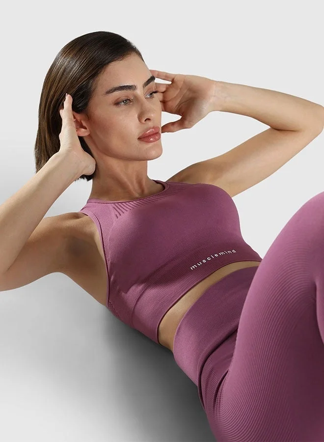Musclemind pink Seamless Sports Bra for Gym Workout and Fitness with rib structure for Posture Assistance, anti-odour, anti-microbial, 4 way stretch, wide straps with removable pads, offers medium support, super soft fabric mesh with quick drying activewear for Women | Best Price UAE