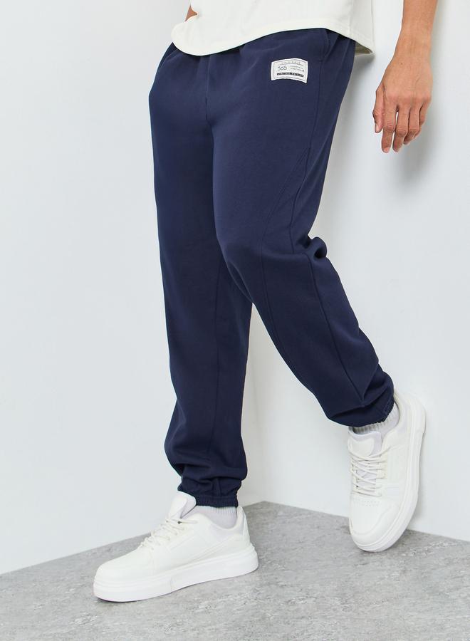 Styli Men Heavy Fleece Joggers with Badge Detail - Image 1