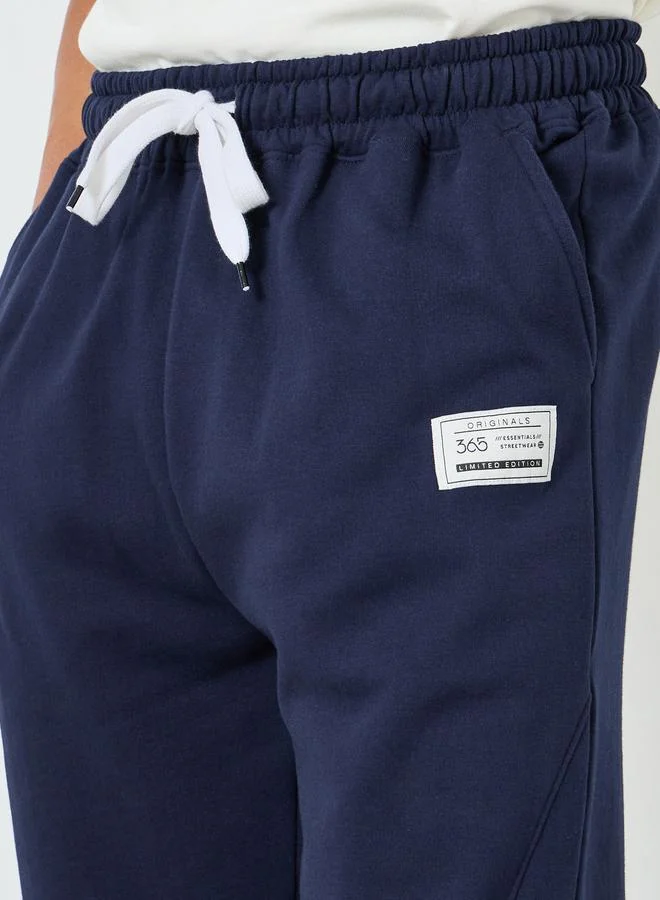 Styli Men Heavy Fleece Joggers with Badge Detail
