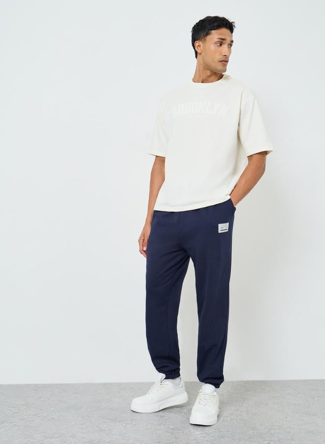 Styli Men Heavy Fleece Joggers with Badge Detail - Image 2