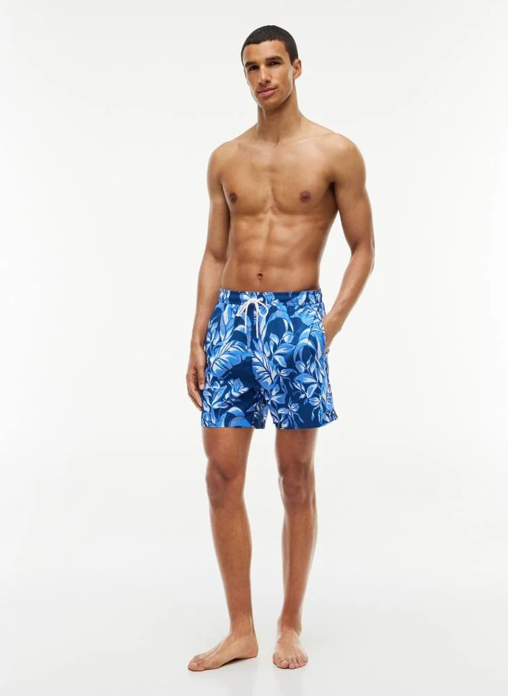 Tommy Hilfiger  Essential Print Mid Length Swim Shorts for Men | Best Price UAE