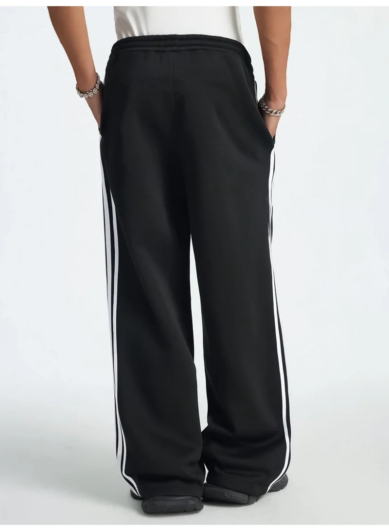 Maniac  Maniac Mens Side Stripe Black and White Cotton Baggy Fit Trackpant for Men | Best Price UAE