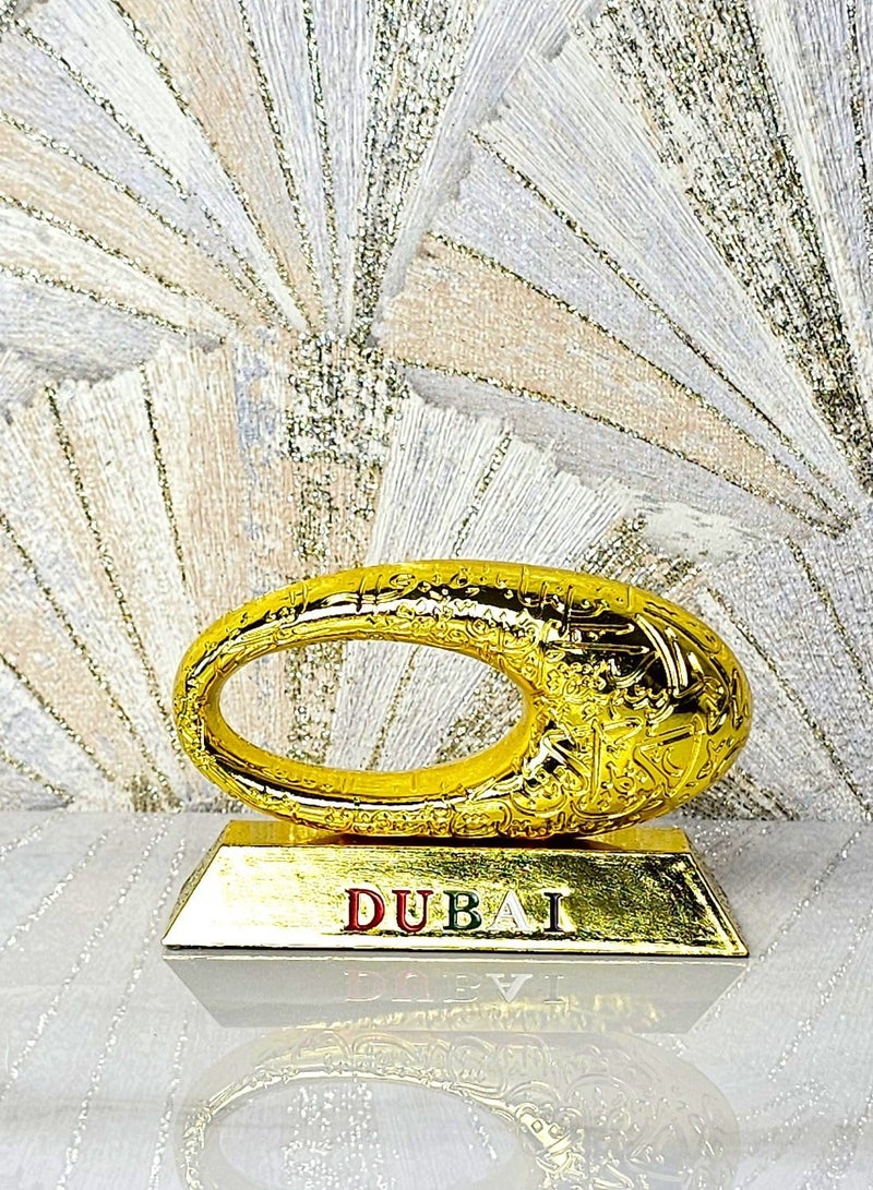 سوق الهدايا التذكارية سوق التذكارات – ديكور متحف دبي معدني، قطعة واحدة مقاس 12×8×4.5 سم بلون ذهبي - Image 1