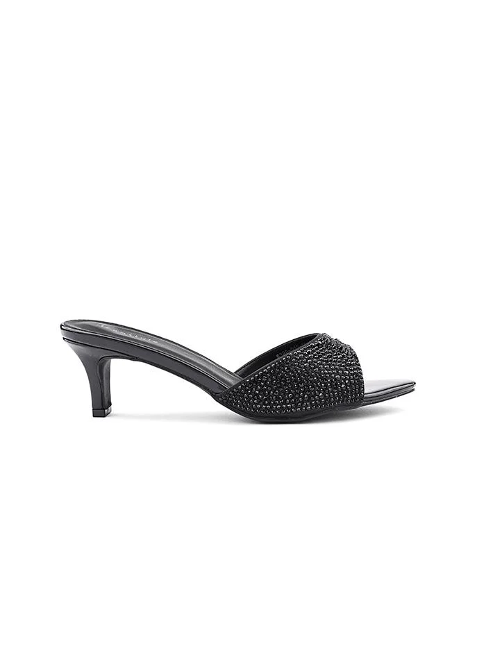أيقون Women's slipper with a comfortable low heel.