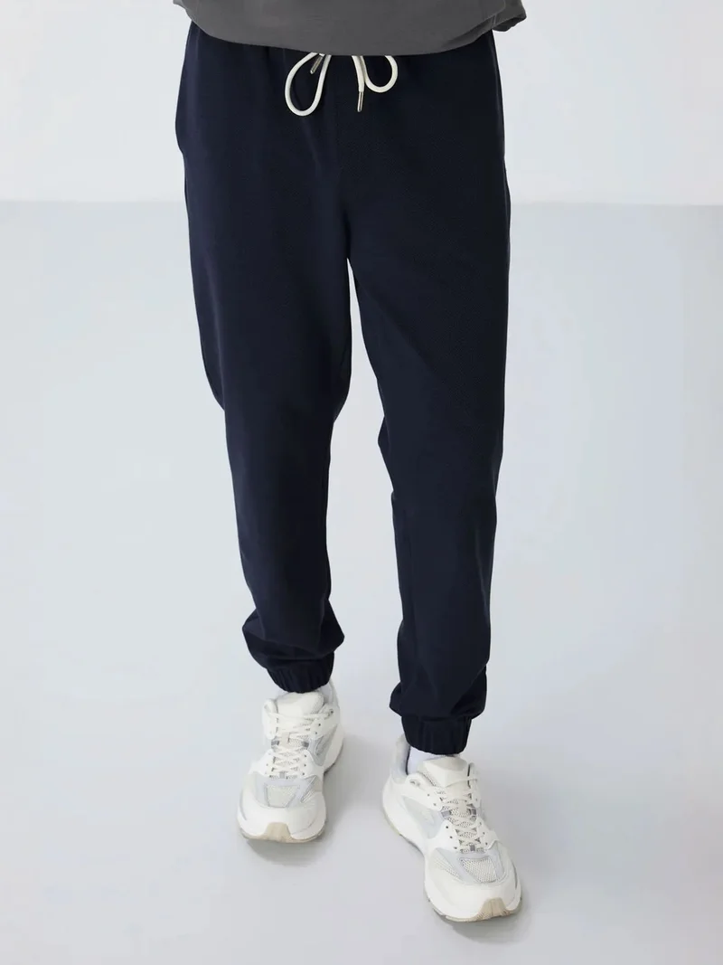 تومي لايف TOMMY Men's Regular Fit Fleece Sweatpants