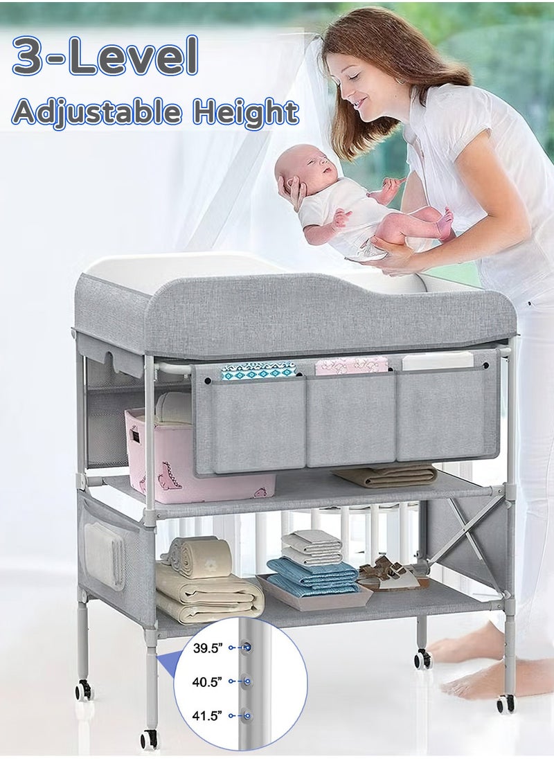 Moovant - Portable Baby Changing Table, Foldable Infant Diaper Station with Wheels, Nursery Organizer, Waterproof Diaper Changing Table, Pad Topper Diaper Organizer with Storage Rack, Strengthen Structure and Adjustable Heights - Image 1