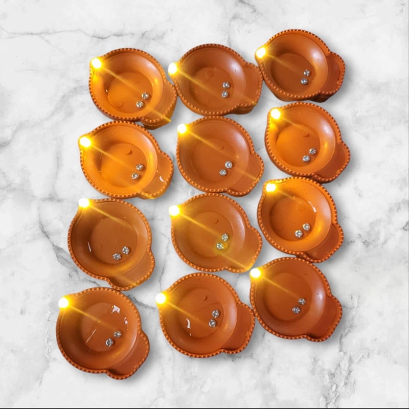 OTISTORES Water Diyas for Diwali Diyas Lights for Decoration Traditional Water Sensor Flameless LED Candles Diyas LED Diyas Candle with Water Sensing Technology for DiwaliPack of 12 - Image 1