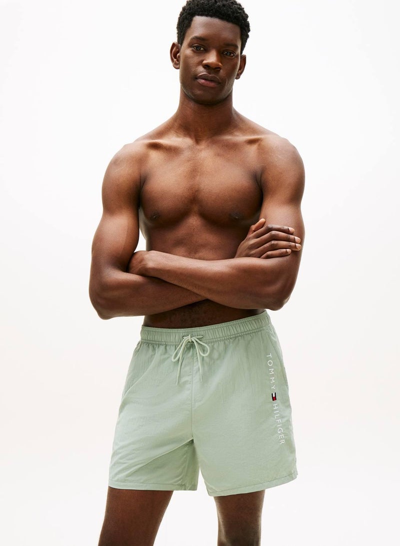 TOMMY HILFIGER Original Logo Mid Length Swim Shorts - Image 1
