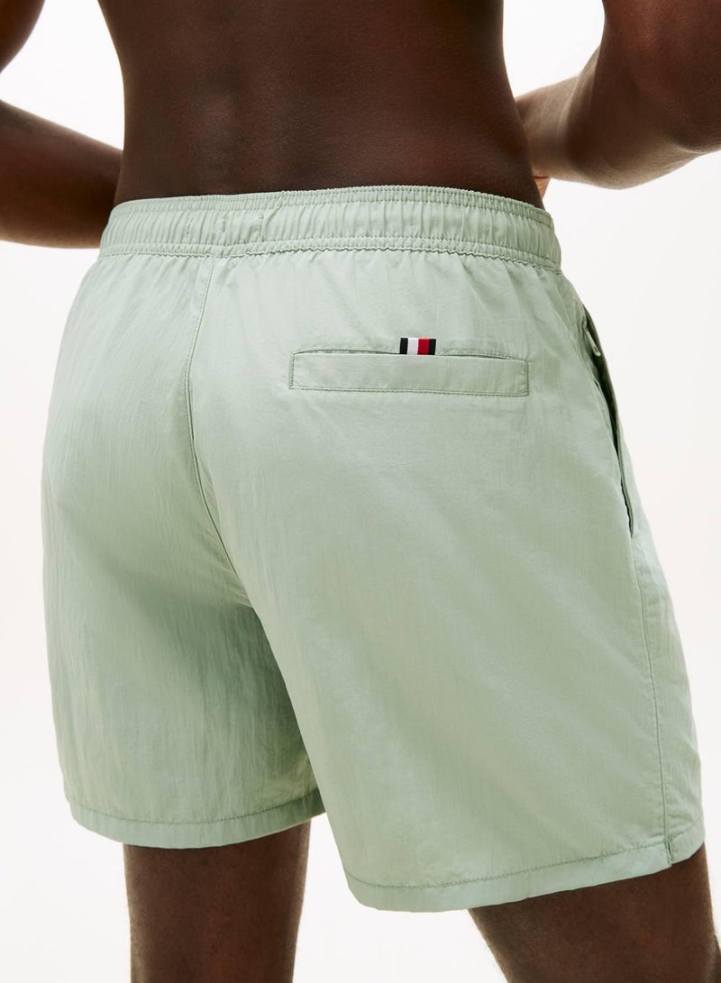 TOMMY HILFIGER Original Logo Mid Length Swim Shorts - Image 4