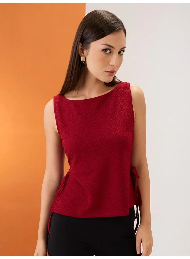 globus Globus Women Maroon Self Design Boat Neck Sleeveless Waist Tie-Up Top