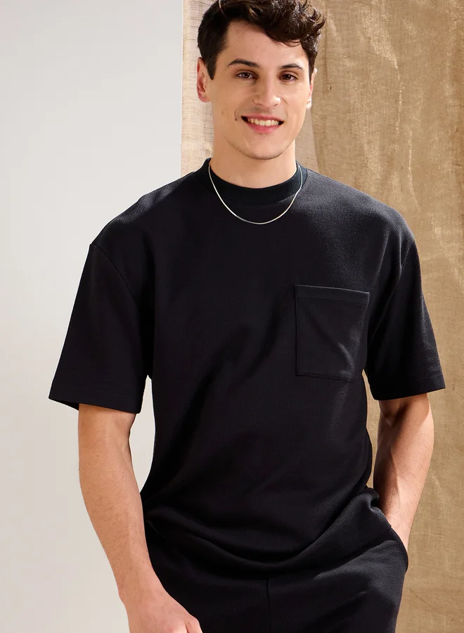 SASSAFRAS Black Waffle Knit Front Pocket Oversized T-Shirt