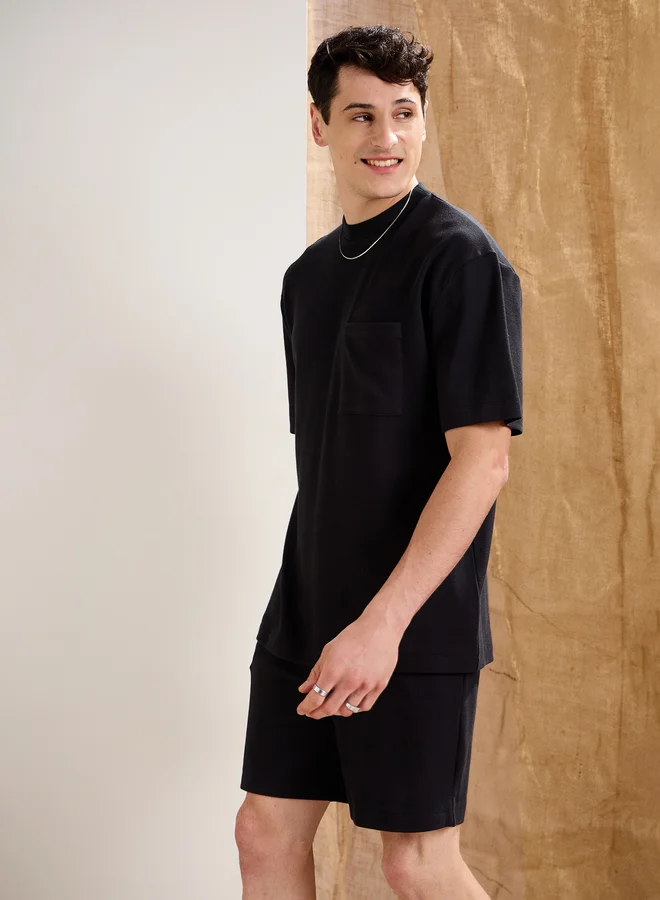 SASSAFRAS Black Waffle Knit Front Pocket Oversized T-Shirt