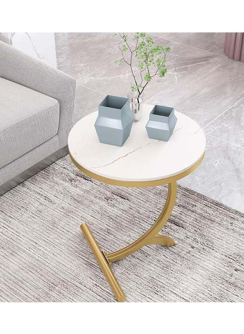 Small C-shaped double-layer side table next to the sofa and bed