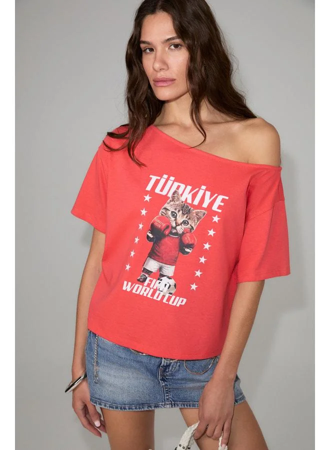 Grimelange MANAIA Women's 100% Organic Cotton One-Shoulder Open World Cup Special Printed Pink T-Shirt.