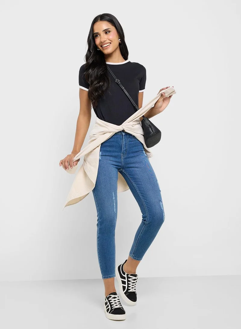 Distressed Mid Rise Skinny Jeans