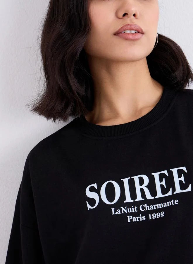 Styli Women Black Oversized Slogan Print Sweatshirt