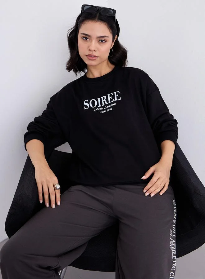 Styli Women Black Oversized Slogan Print Sweatshirt