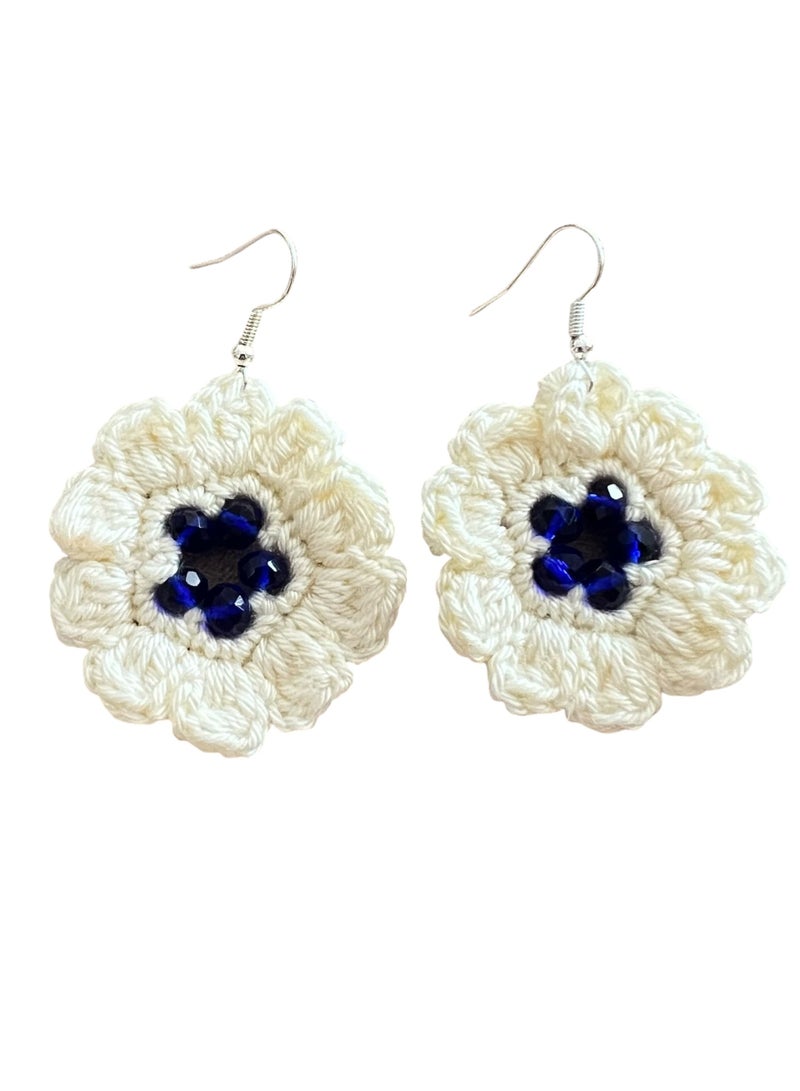 Lolly Handmade Crochet Flower Earrings – These beautiful earrings feature a large, intricate flower design made with soft, high-quality yarn. The white petals are complemented by a deep blue  center, creating a striking, yet elegant accessory. Perfect for adding a touch of floral charm to any outfit, whether you're dressing up for a special occasion or adding flair to your daily look - Image 3