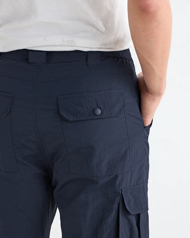 Bewakoof  Men's Navy Blue Cargo Nylon Parachute Pants for Men | Best Price UAE