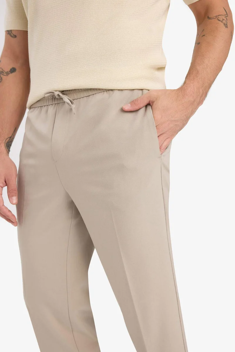 Defacto  Elastic Waistband and Pockets Stretchy Jogger Fit Trousers for Men | Best Price UAE