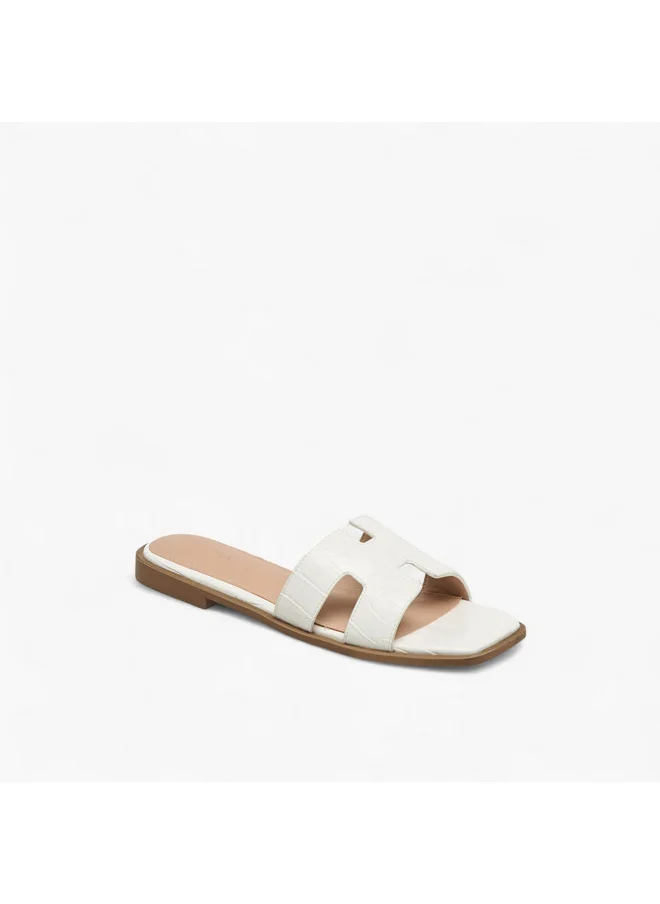 فلورا بيلا من شو إكسبرس Women Textured Slip-On Flat Sandals with Cut-Out Deatil