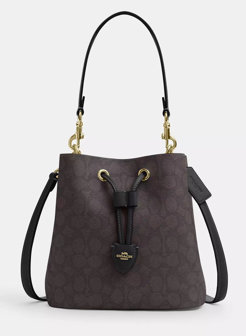 كوتش اوت ليت حقيبة كوتش روان دلو من القماش المميز مع حزام قابل للفصل، حقيبة كتف نسائية، حقيبة كروس نسائية، حقيبة توت نسائية، حقيبة يد نسائية، حقيبة سفر نسائية، لون الجوز الأسود - 22 سم - Image 1