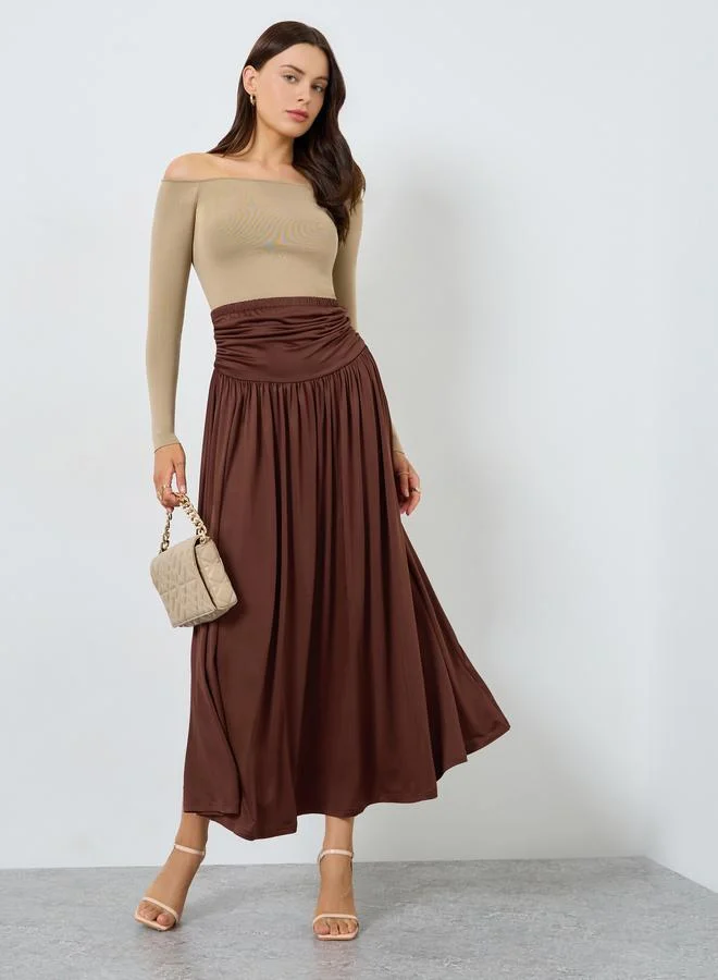 Styli Brown Solid A-Line Pleated Knit Maxi Skirt