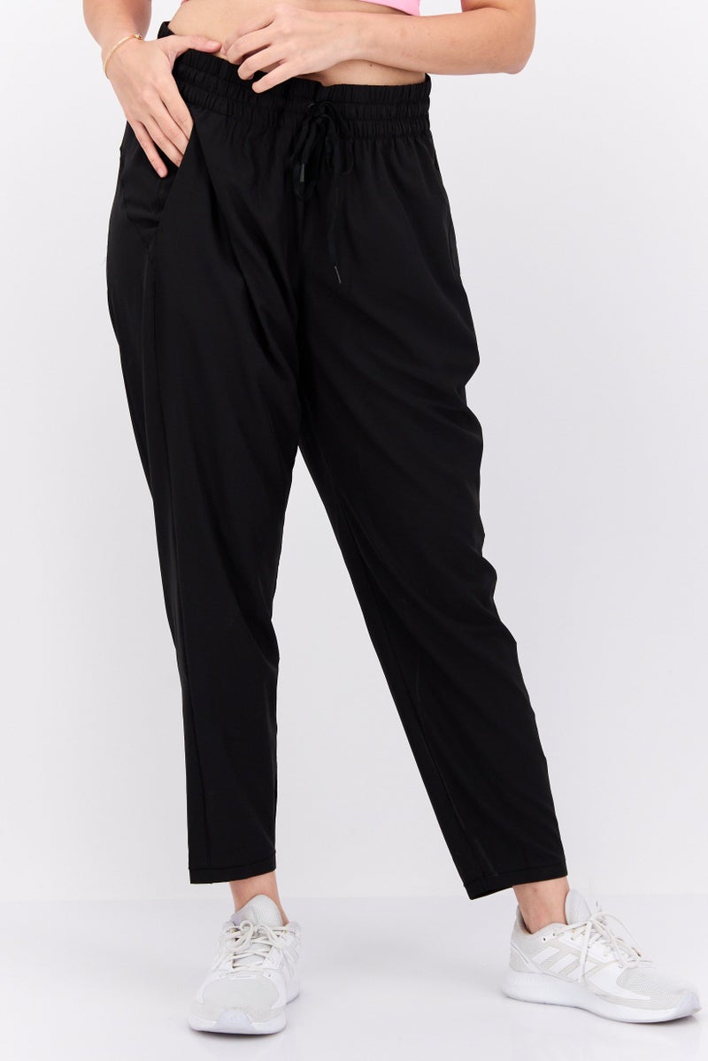 PUMA Women Sportswear Fit Solid Outdoor Track Pants, Black - Image 1