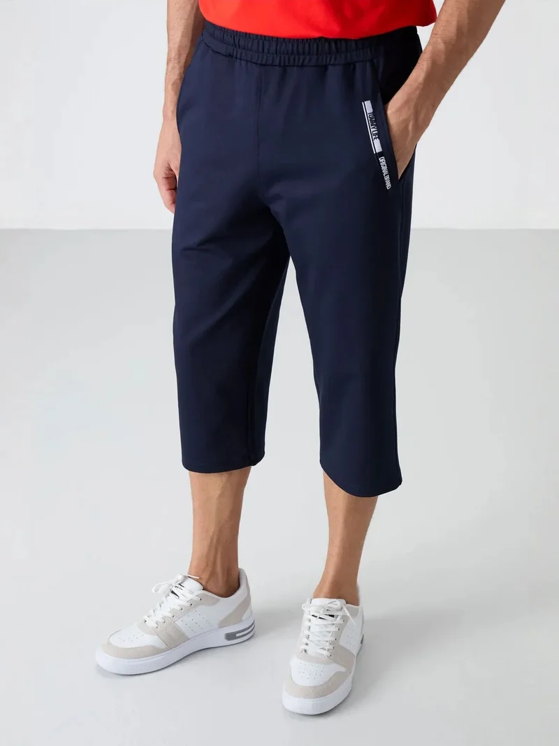 تومي لايف TOMMY Men's Mid-Waist Capri Shorts