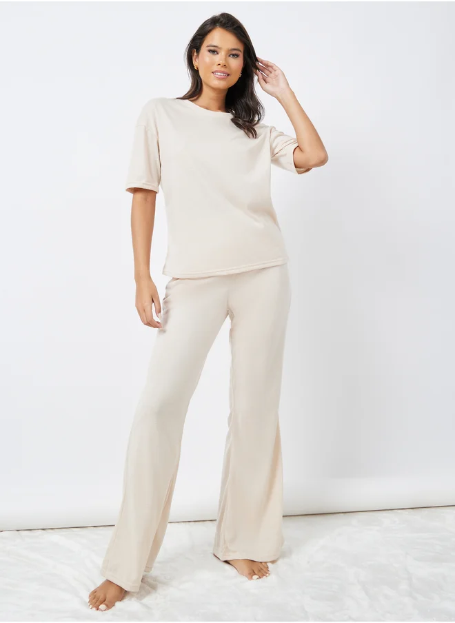 Styli Styli Drop Shoulder Oversized T-Shirt and Flared Pyjama Set