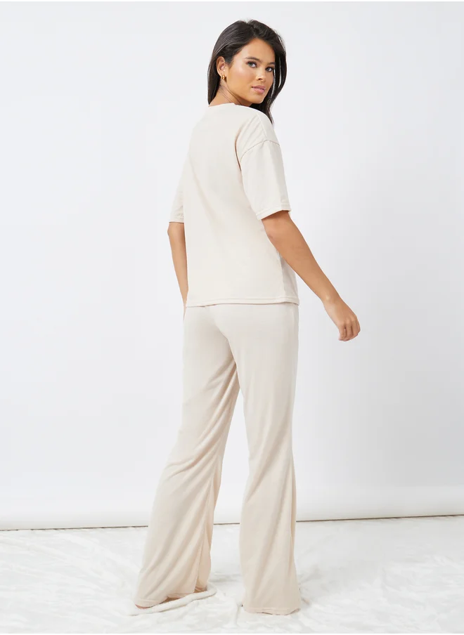ستايلي Styli Drop Shoulder Oversized T-Shirt and Flared Pyjama Set