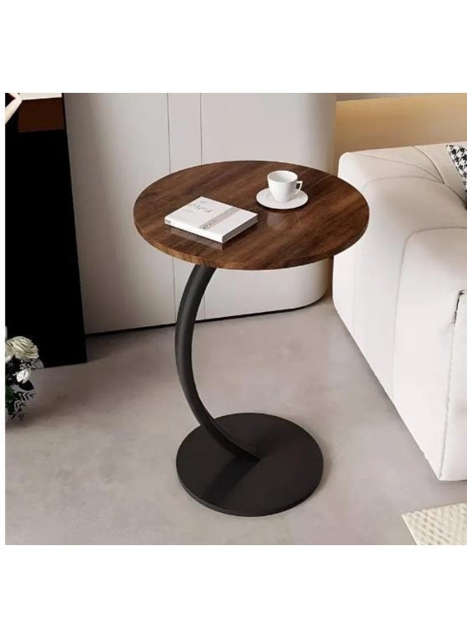 A modern C-shaped side table with a stylish oval top and sturdy metal legs = elegance and practicality in one! It slides easily under a sofa or bed and is perfect for coffee, your laptop, or your favorite book. Its contemporary design adds a decorative touch to any corner. - Image 4